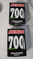 Front view of two boxed Kenda 700 inner tubes