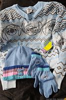 Sweater, hat and gloves grouped