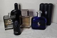 Group shot of all six cologne bottles
