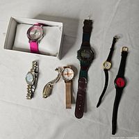 Group shot of seven assorted wristwatches