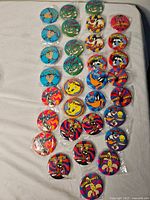 All 29 buttons arranged on surface showing designs