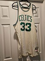 Full front view of jersey on hanger