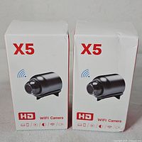 Two boxed X5 Wi-Fi Cameras