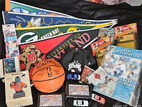 Overview showing pennants, basketball, cap, cars, packs, binder