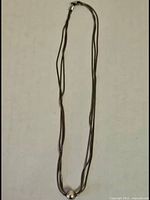 Full view of three-strand sterling necklace