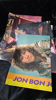 Stack of magazine posters, top poster Jon Bon Jovi
