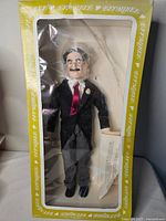 Front view of doll inside Effanbee window box