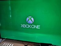 TV screen displaying Xbox One startup logo
