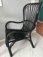 Side view of black bamboo armchair