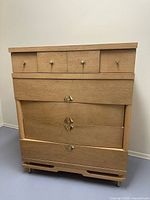 Front view showing all drawers and hardware