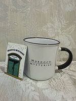 Mug front view beside magnet