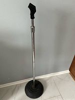 Full view of adjustable microphone stand with base