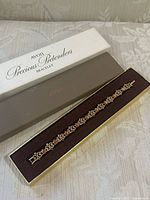 Bracelet in open Avon Precious Pretenders box showing full length and packaging