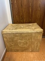 Closed vinyl-covered chest front and top