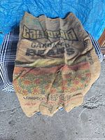 Full view of burlap sack showing graphics
