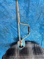 Full view of folding hole digger showing overall design