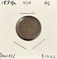 Obverse of 1874 Indian Head cent in 2×2 flip with damage notation