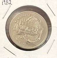 Obverse of 1982 North Bay trade dollar showing canoeist scene