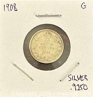 Reverse side of 1908 Canadian 10-cent coin in cardboard holder