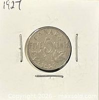 Reverse of 1927 Canadian 5-cent coin showing denomination and maple leaves