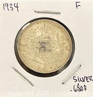 Obverse showing Belgian coat of arms in cardboard flip marked 1934 F