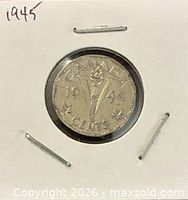 Reverse showing CANADA 1945 torch and V design