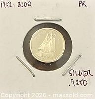 Reverse side of 1952-2002 silver proof dime in cardboard flip