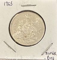 Reverse of 1963 Canadian 50-cent coin showing Canadian coat of arms and denomination
