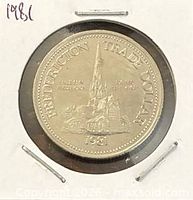 Obverse of 1981 Fredericton Trade Dollar coin in holder