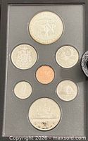 Front view of seven-coin proof set in case