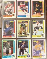 Front view of nine O-Pee-Chee cards in plastic sheet