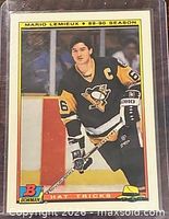 Front of 1990-91 Bowman Hat Tricks #3 Mario Lemieux hockey card in sleeve