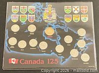 Full presentation card showing 13 coins and provincial shields