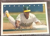 Front of Rickey Henderson Upper Deck card showing action slide