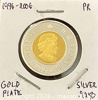 Obverse of coin showing Queen Elizabeth II, sterling silver ring and gold-plated core