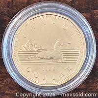 Reverse side showing loon, year 1999, encapsulated