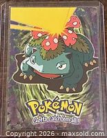 Front of Venusaur trading card inside plastic sleeve