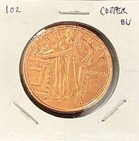 Obverse of copper round showing standing Liberty motif in 2x2 flip