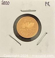 Reverse of 2000 proof cent showing maple leaves