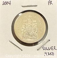 Reverse of 2004 Canadian 50-cent proof coin showing Canadian Coat of Arms in 2x2 flip