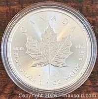 Reverse of 2022 Silver Maple Leaf coin in capsule