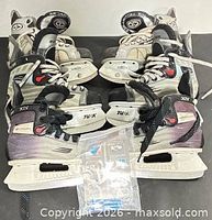 All three pairs of skates grouped together showing sizes and overall condition
