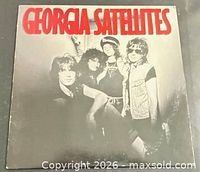 Front jacket showing title and band photo