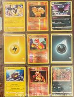 Front view of nine Pokémon cards in binder sleeve
