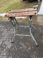 Overall view of Workmate showing wooden top and steel folding legs
