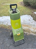 Full view of Sun Joe CJ601E wood chipper on driveway