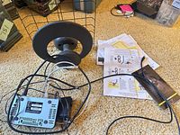 Antenna, AirTV box underside, cables, manuals visible