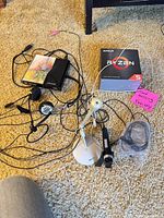 All items together showing AMD box, microphones, headset, sound bar, cables