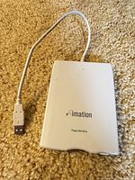 Top view showing Imation logo and attached USB cable