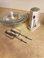 Mixer, beaters and three nested bowls overview